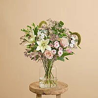Easter flower bouquet with lilies and roses
