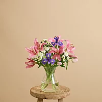 Easter flower bouquet with lilies and irises