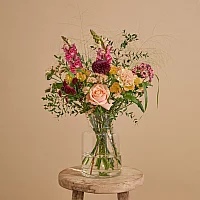 Valentines Day flower bouquet with roses snapdragons and carnations