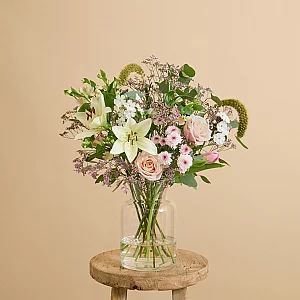 Easter flower bouquet with lilies and roses