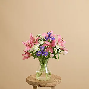 Easter flower bouquet with lilies and irises