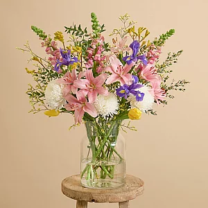 Easter flower bouquet with iris tulips and lilies